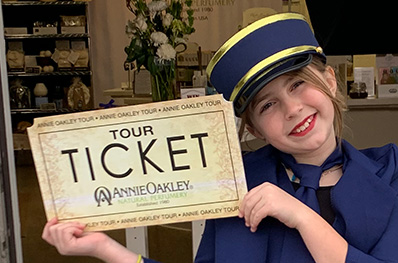 Young Girl holding a tour ticket